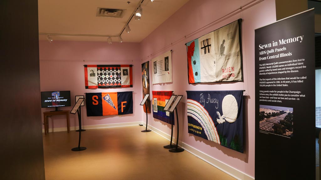 photos of calypso hung on the orange wall
