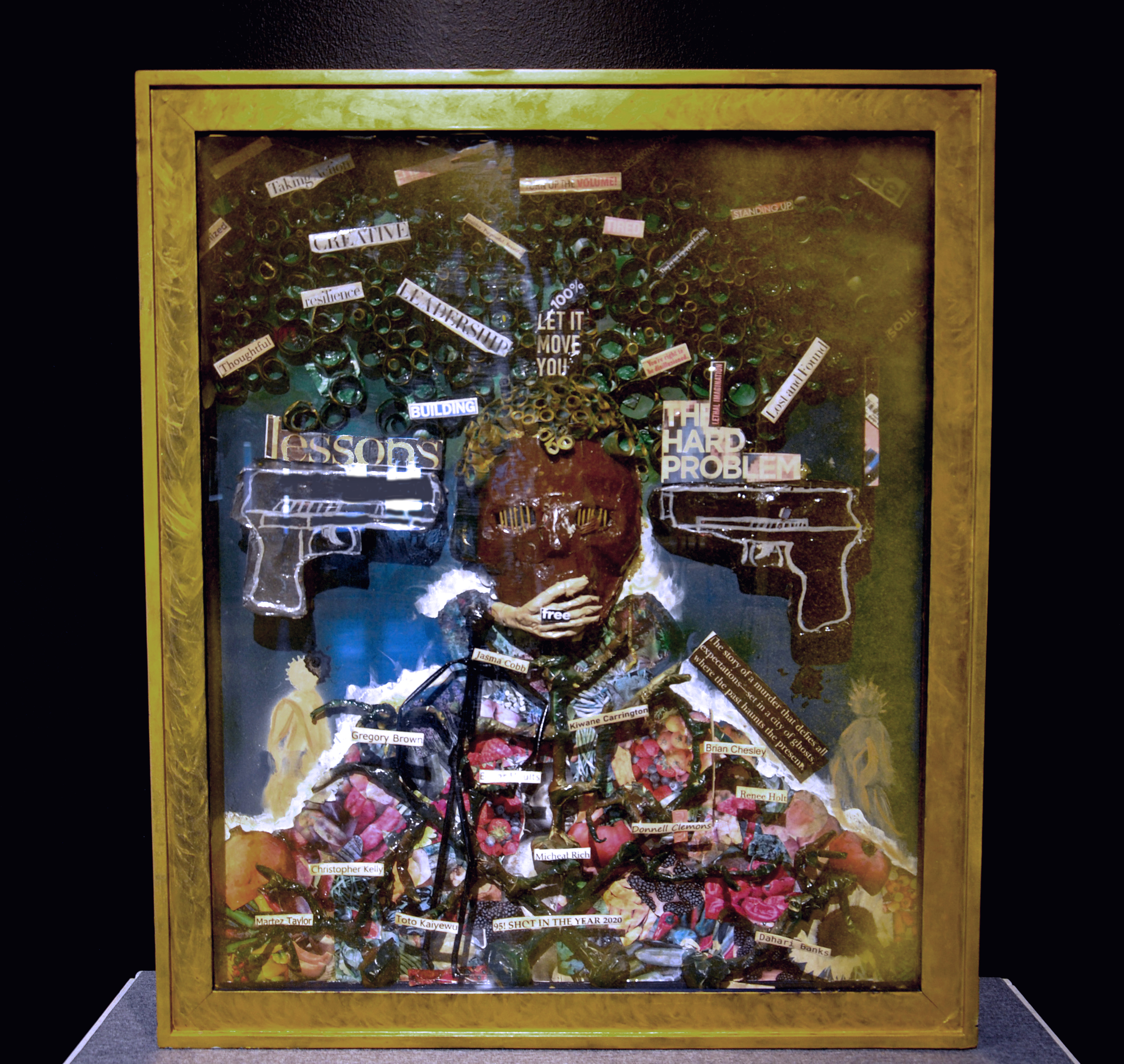 the framed art piece of Seeds of Injustice made of different elements