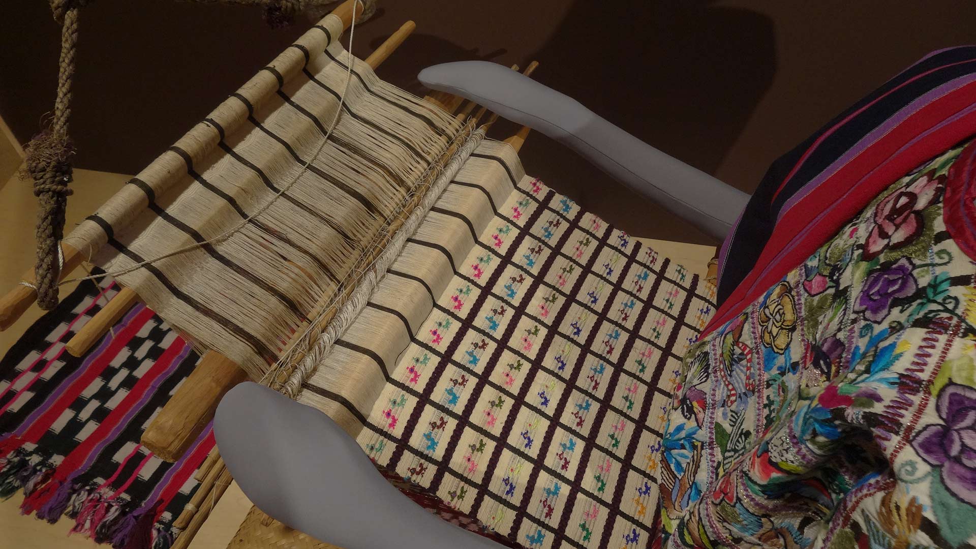 weaving tools featuring Maya clothing being made