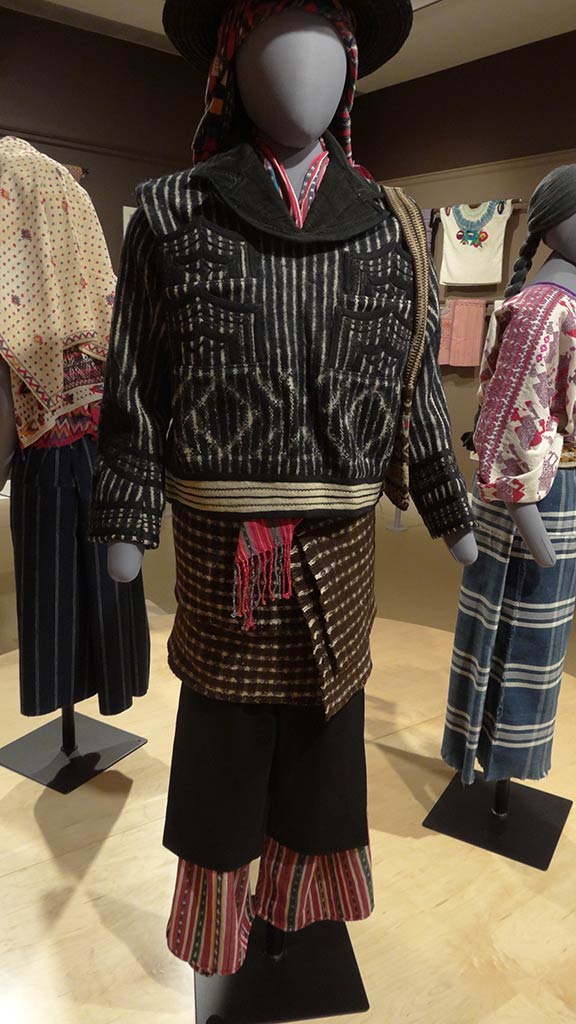 black hat, patterned top, and bottom.