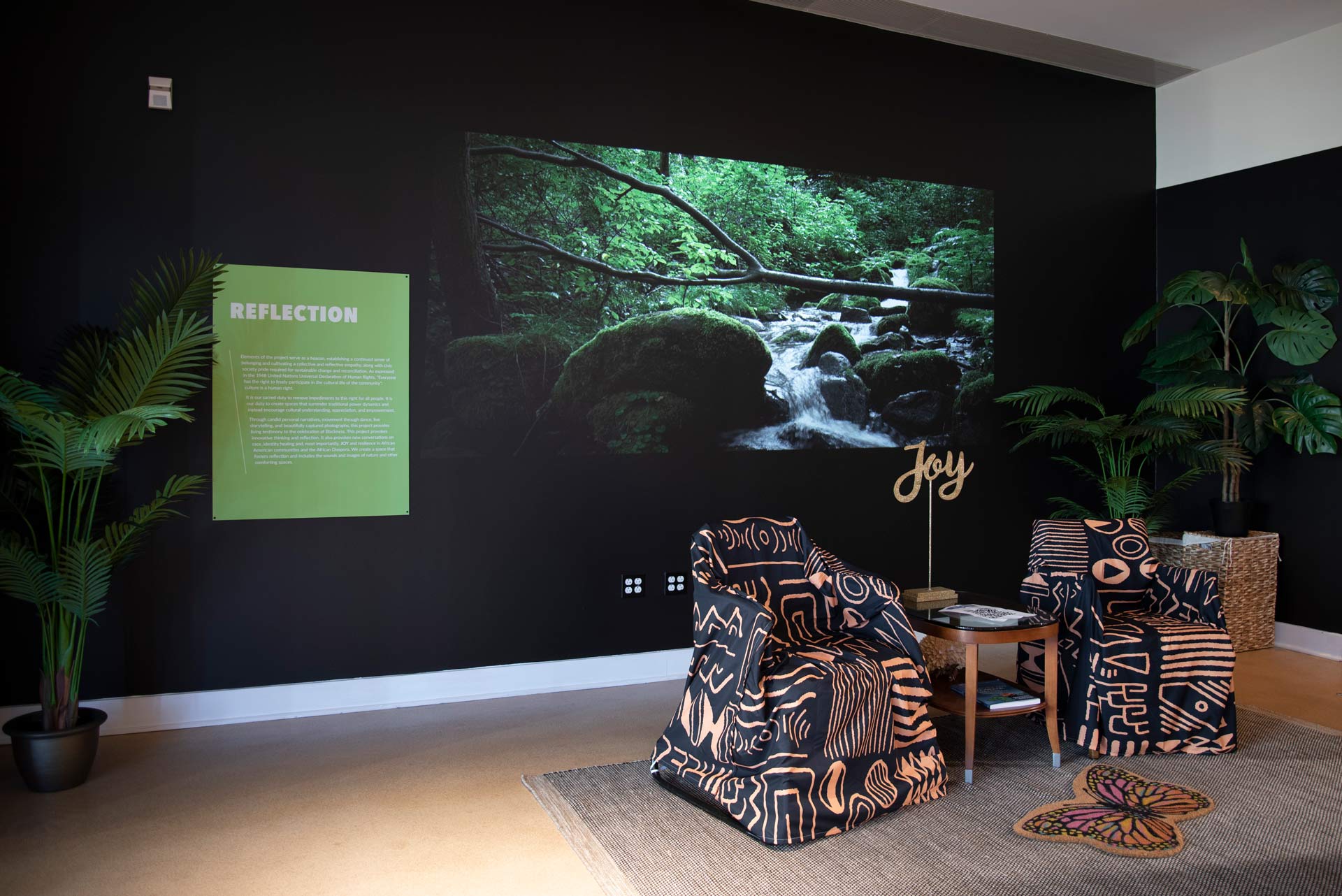 An overview of the reflection space with a projection of a calming water visual