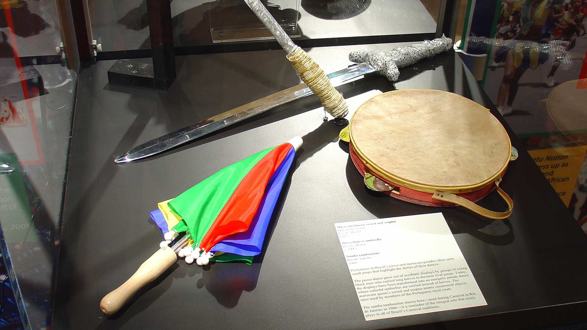 drum, colorful umbrella and swords