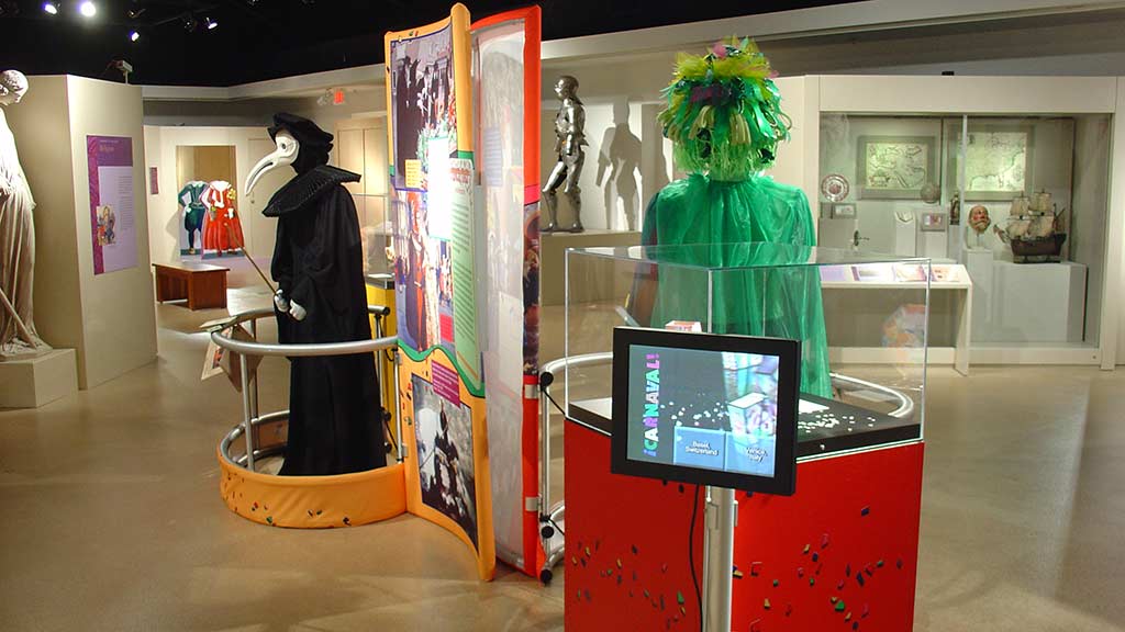 green clown backview and the side view of a man in black