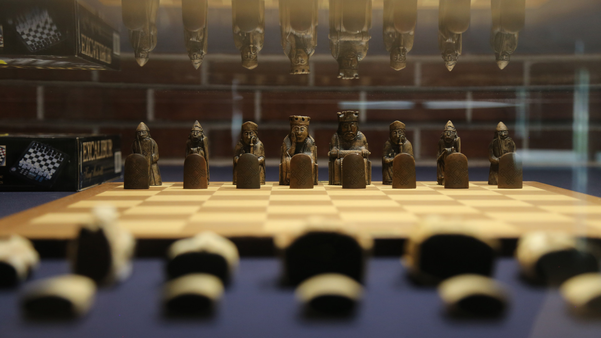 another closeup shot of the same case from the perspective of one chess side to the other, staring at the other pieces that are brown