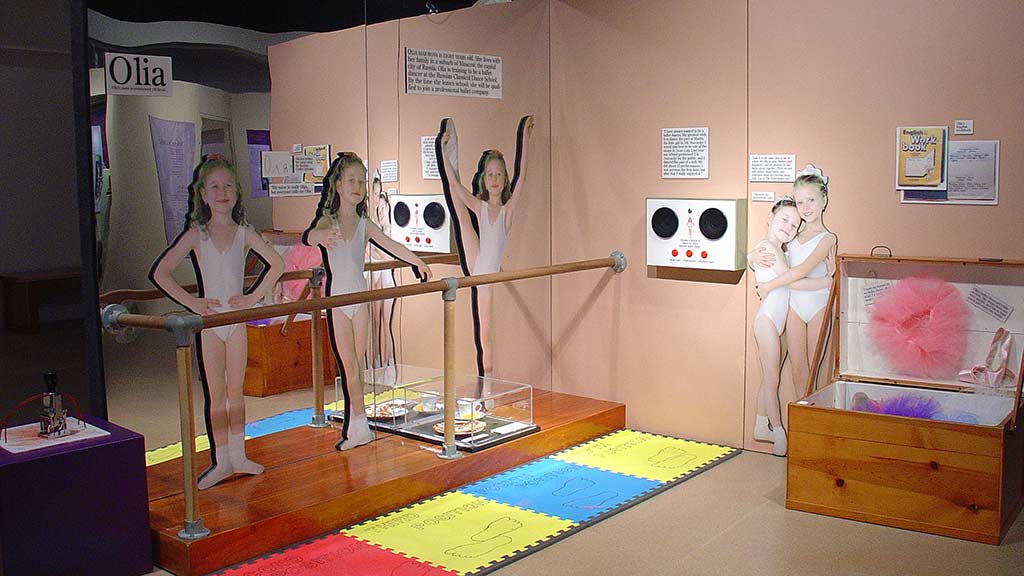 children in Olia section, several girls dancing ballet while wearing ballet clothing