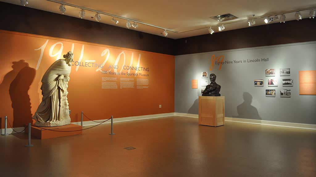venus and lincoln sculptures in a big room with writing and pictures on the walls