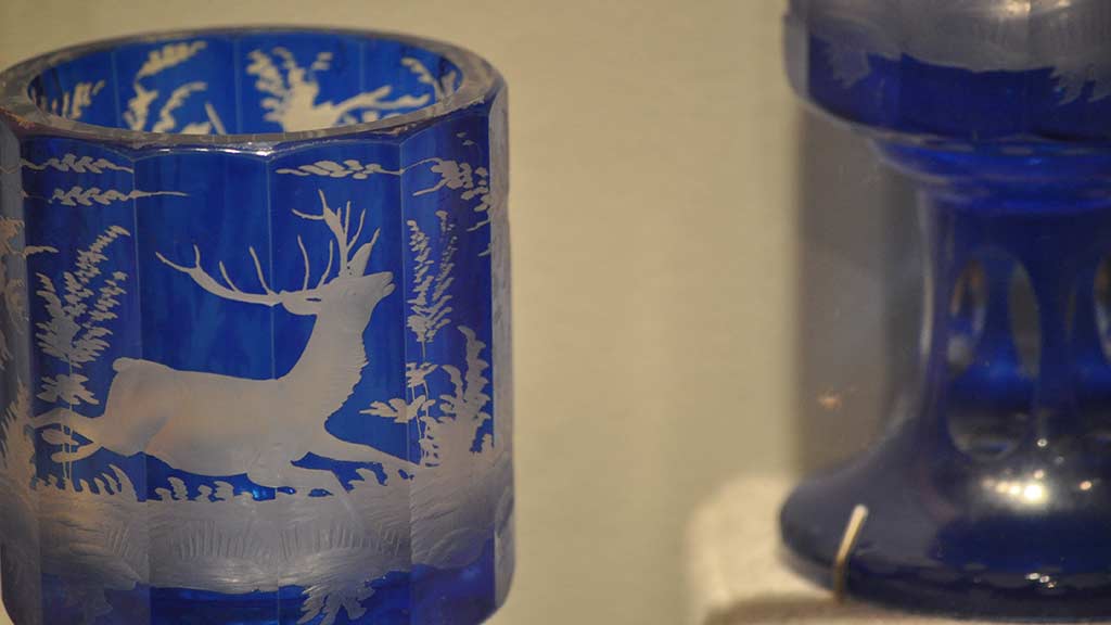 blue glass with white deer pattern
