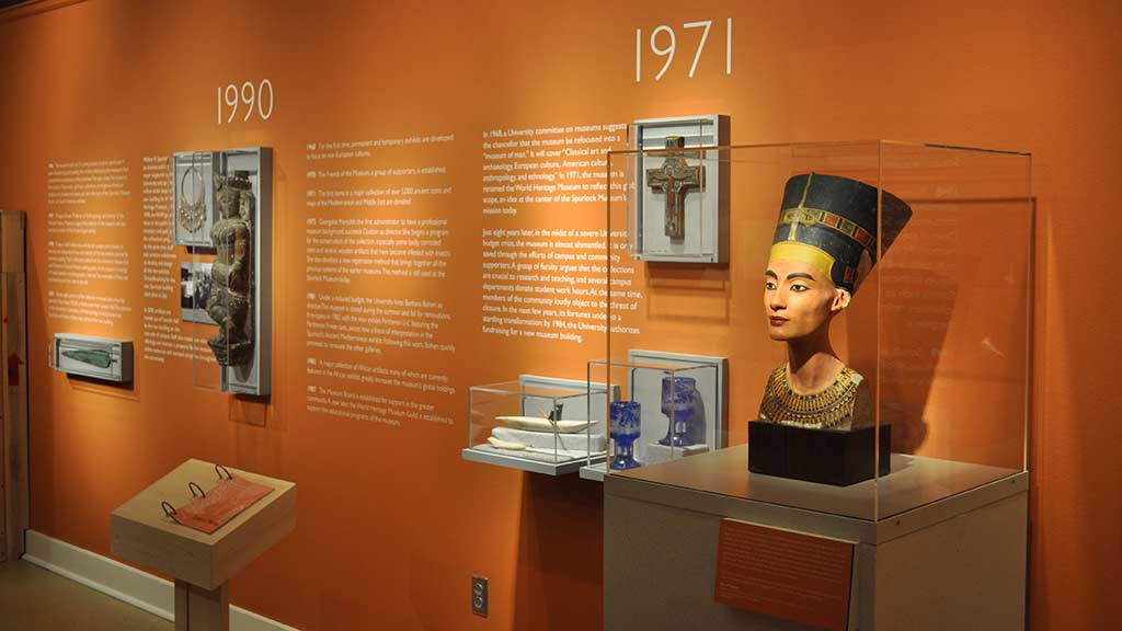sculpture of pharaoh side view showing different objects and the year 1971 above
