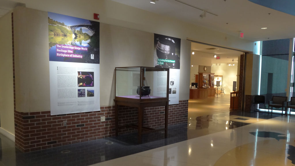 left side exhibit overview, a cooking iron pot in the plexiglass