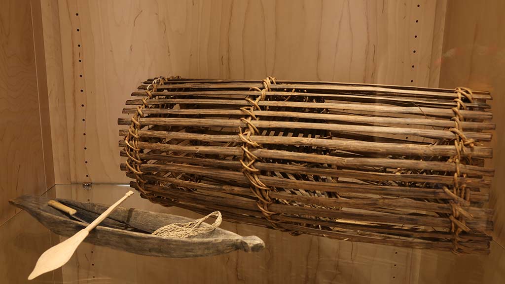 wooden canoe and wooden fish trap