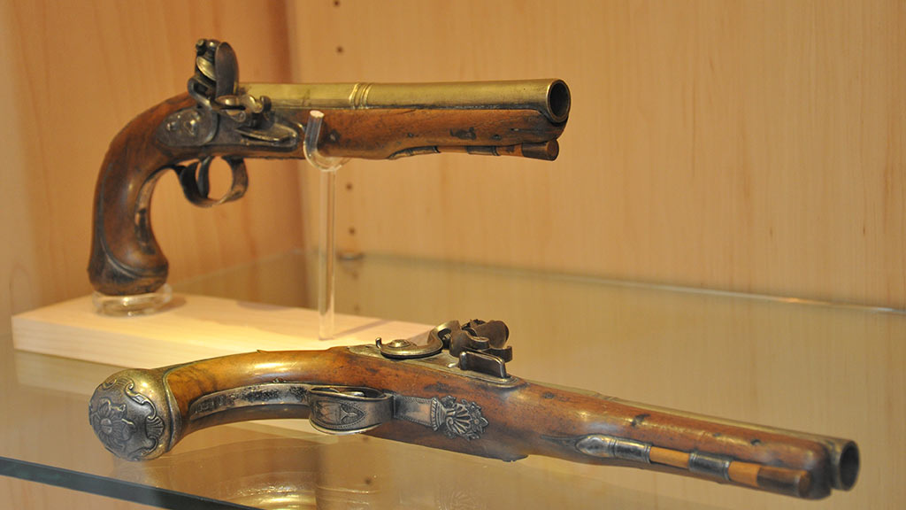 two pistols made of bronze and wood