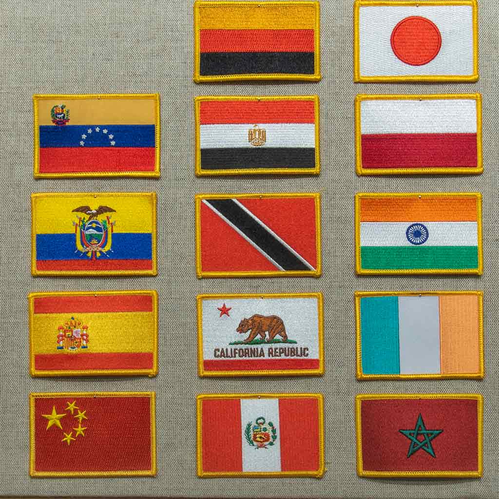 assortment of country flags that graduates may put on their stole
