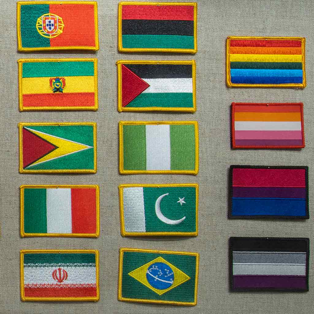 assortment of country and pride flags that graduates may put on their stole
