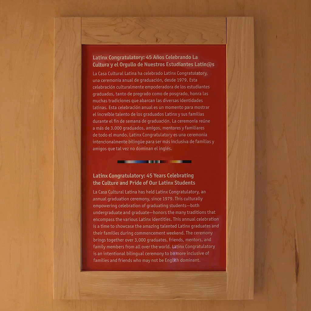 A plaque describing the history of the Latinx Congratulatory in Spanish and English language