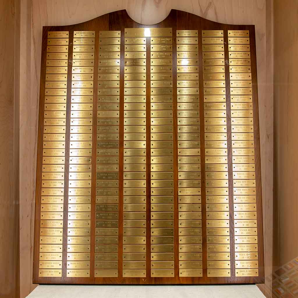 A plaque of outstanding Latinx graduates' names