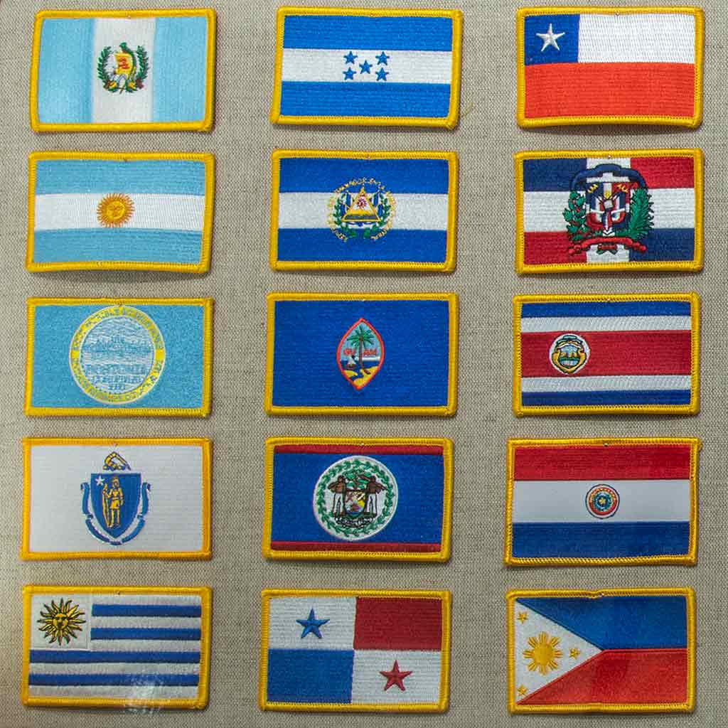 assortment of country flags that graduates may put on their stole