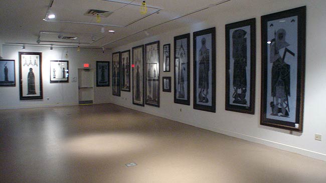 alternate view of collection of brass rubbings hung on the wall