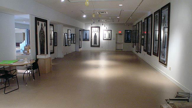 overview of collection of brass rubbings hung on the wall