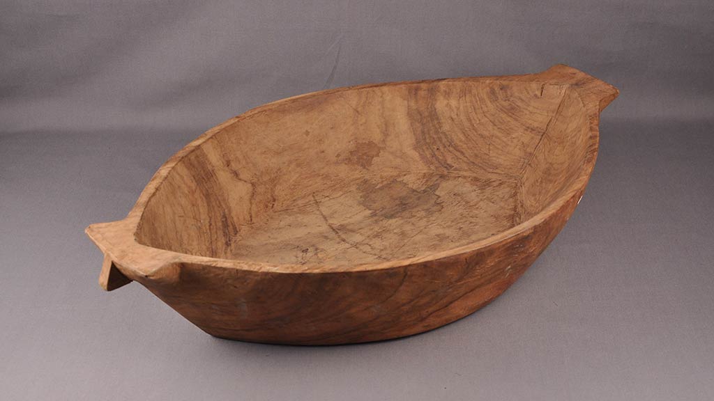 wooden bowl that looks like a boat