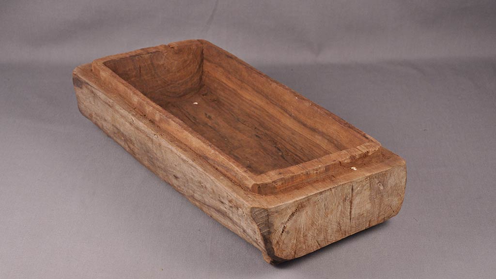 wooden bowl that looks like a coffin