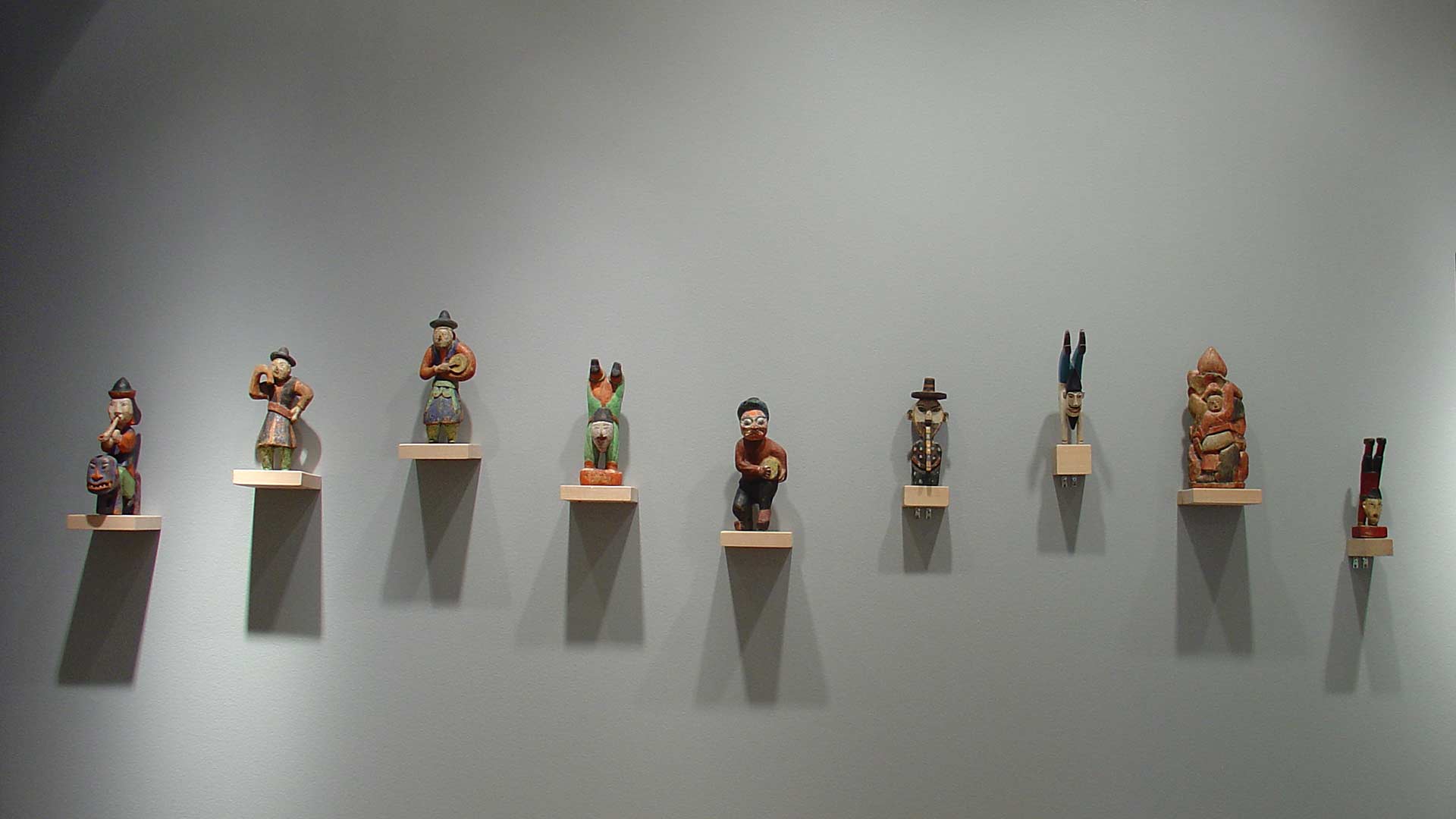 figurines arranged on the wall