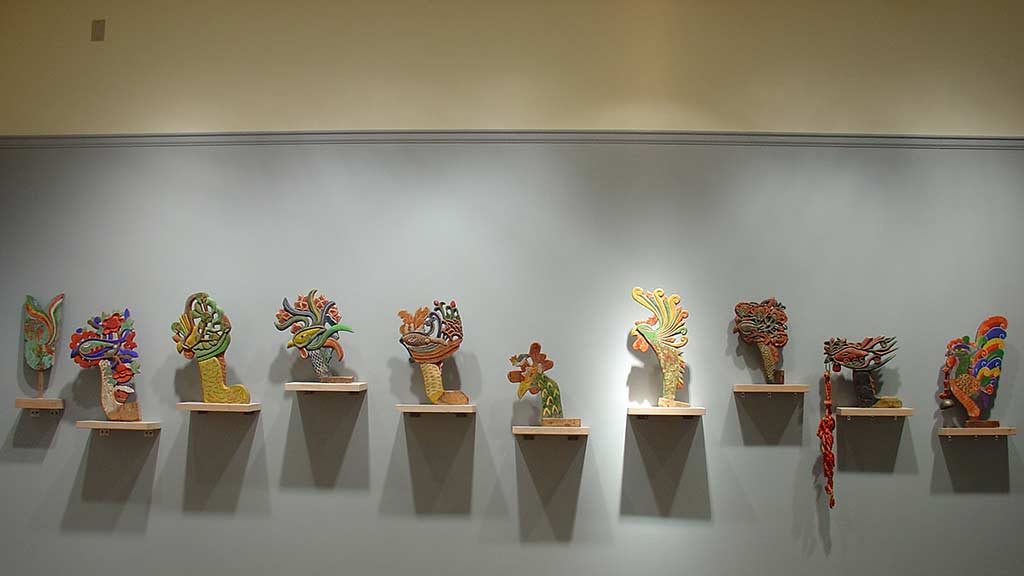 animal sculptures arranged on the wall