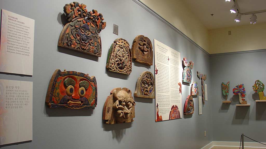 large plates sculpted with animal faces, view from an angle