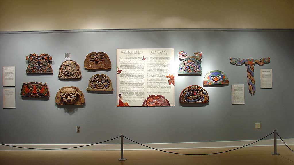 front view, large plates sculpted with animal faces