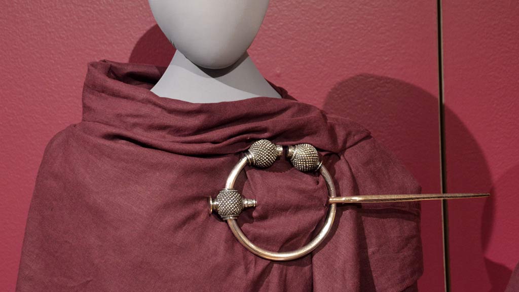 Tara Brooch on red fabric