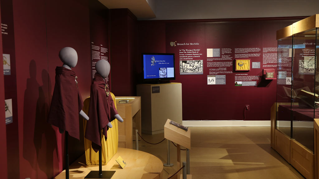 gallery view, TV, mannequins and red walls