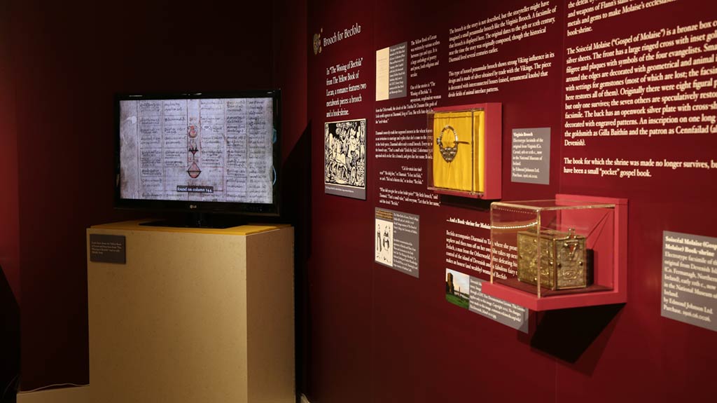 objects displayed on the wall and a TV playing a video