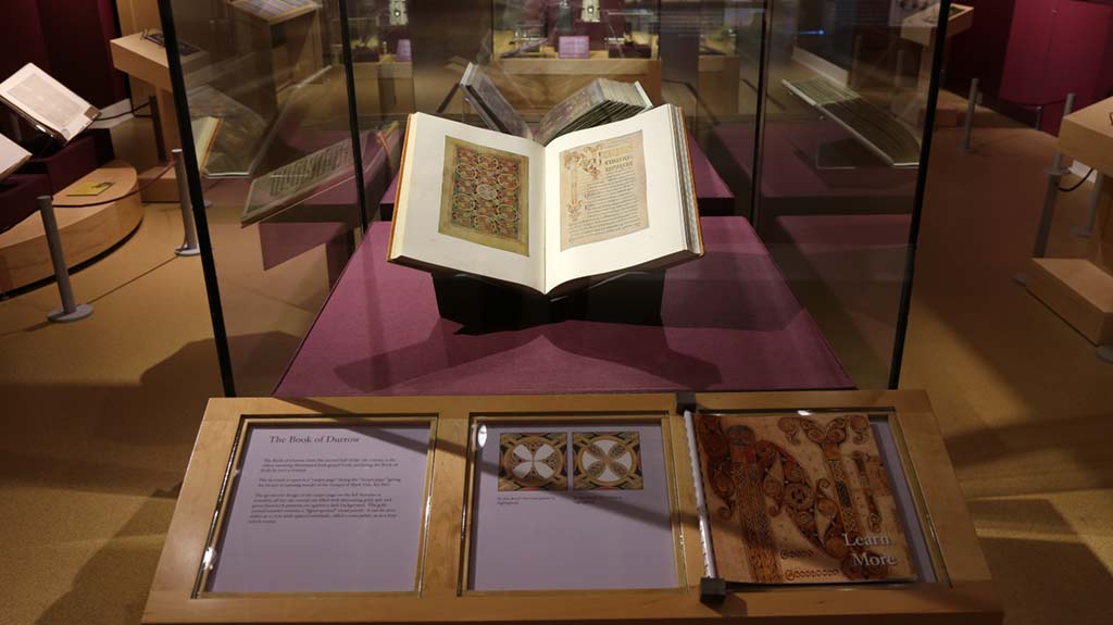book illustrating intricate patterns in a exhibit case