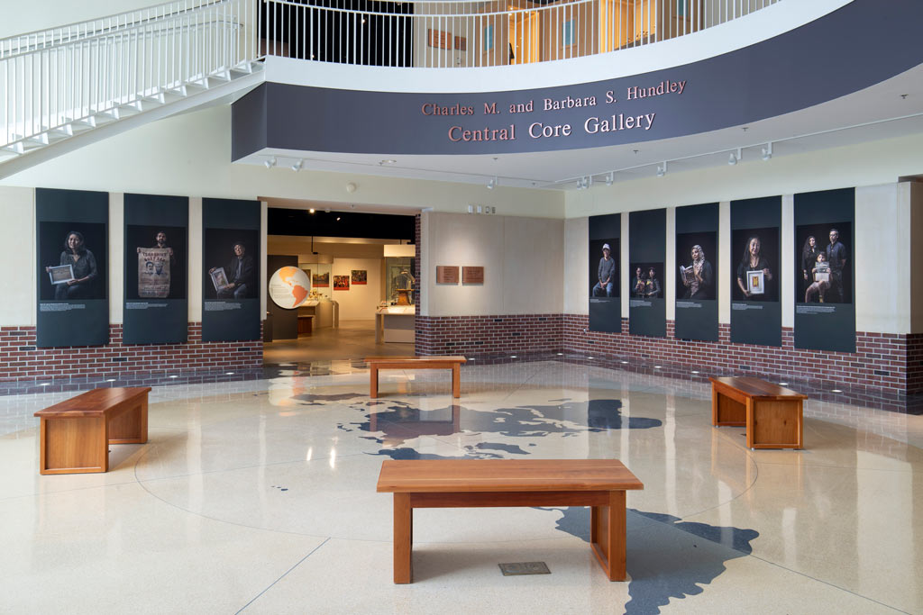 eight posters in the Central Core Gallery depicting internemnt survivors and stories