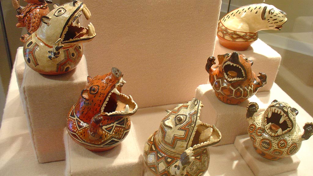 ceramic animals oppening their mouths and showing teeth