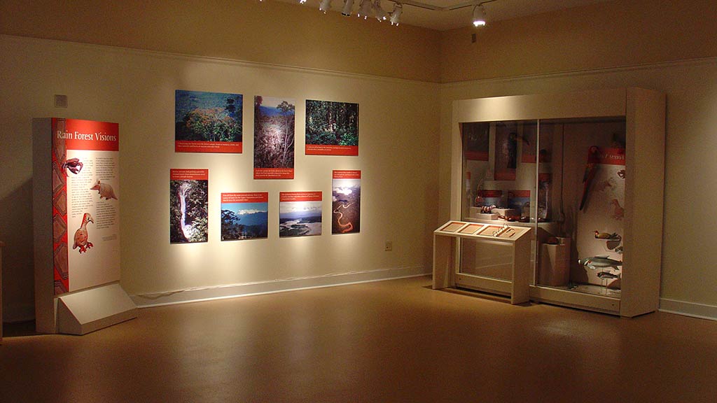 corner of the gallery with a display case and text panels