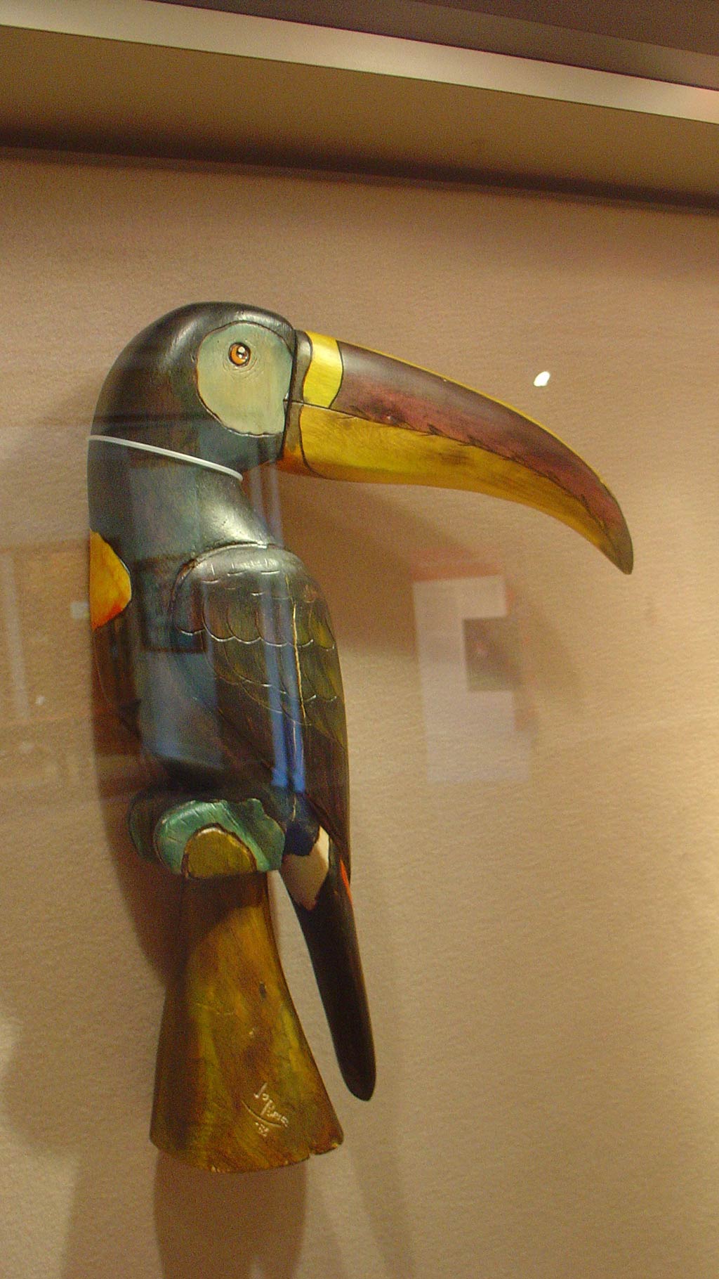 wooden sculpture of the parrot