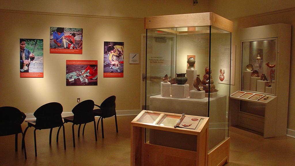black chairs, photos, two display stands