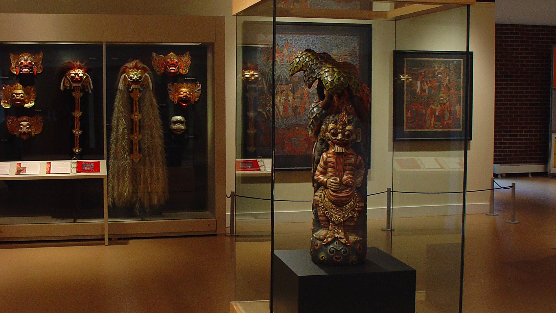 sculptures of the demons in the display cases