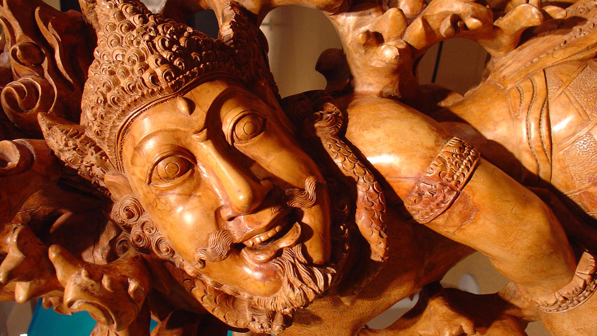 wooden sculpture of a buddism god