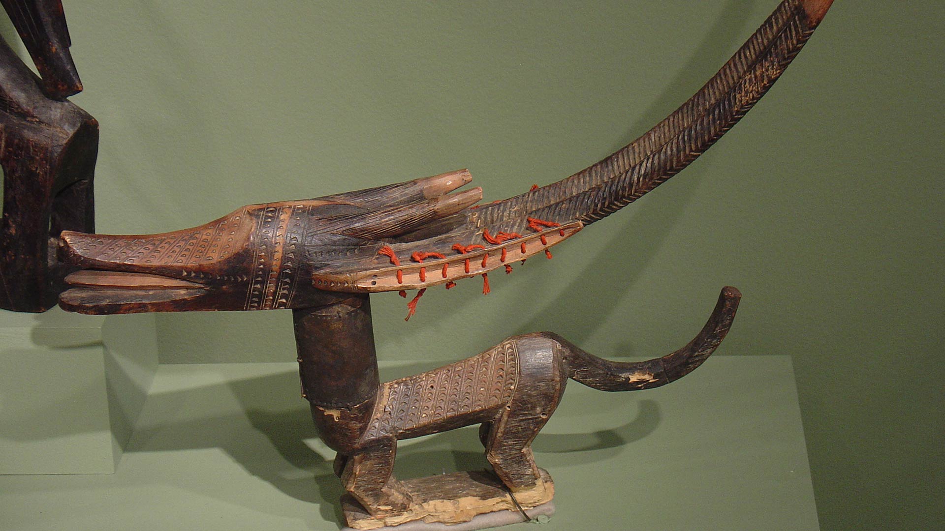 wooden sculpture that looks like a dog