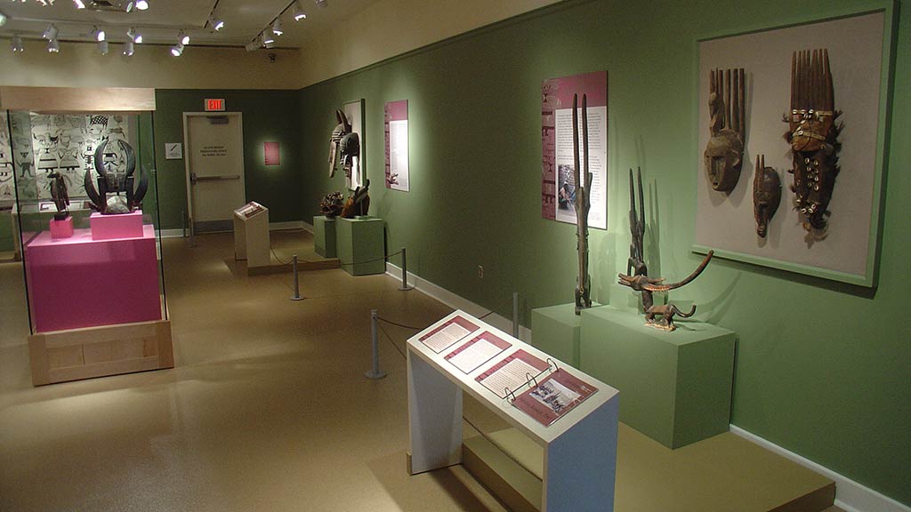 an image of the right side of the exhibit featuring some of the sculptures and masks